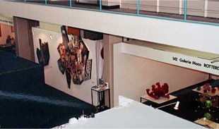 Stand view of Galerie Maas, with shaped, diptych and triptych paintings by Paul Critchley